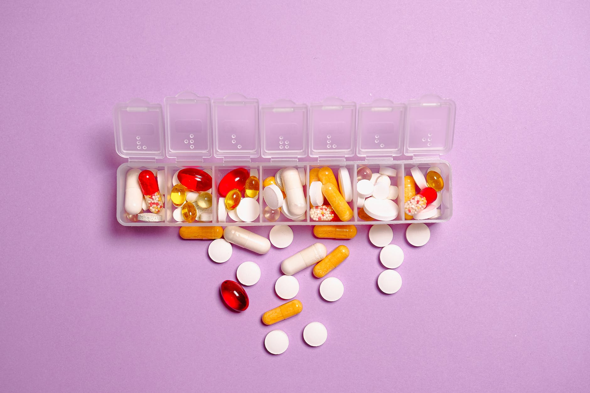 photo medication pills on white plastic container