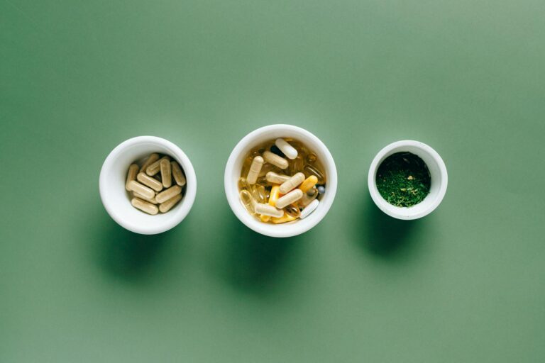 white ceramic bowls with supplements. multivitamins vegans