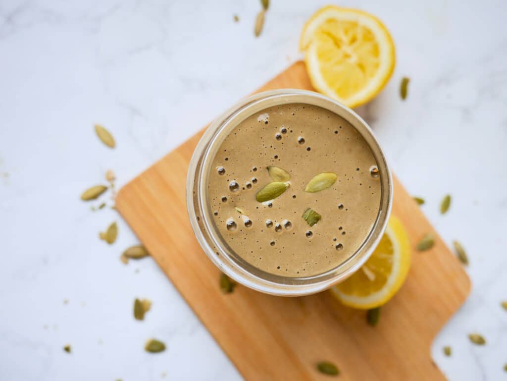 High iron smoothie on wooden board in glass jar