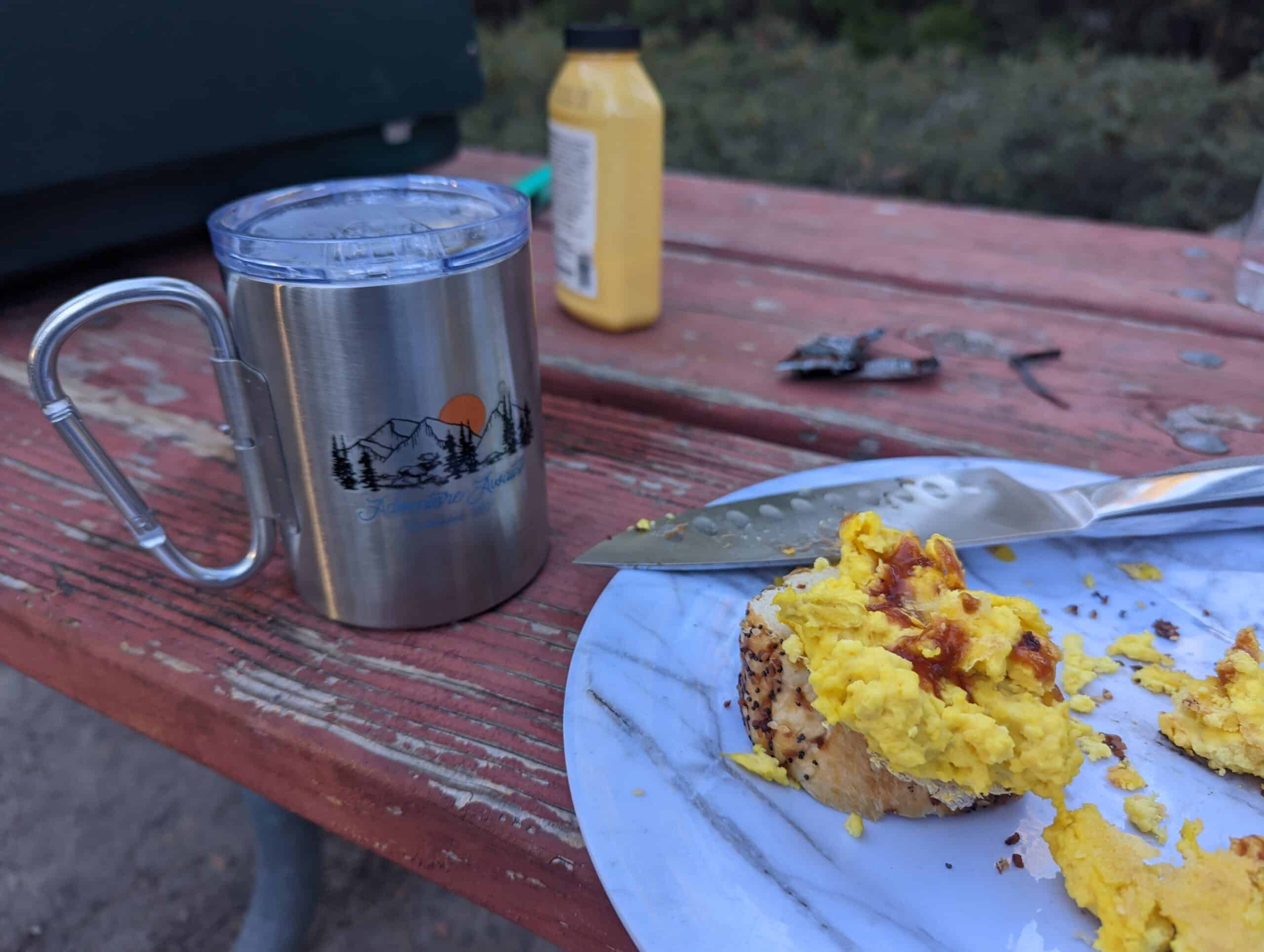 vegan camping breakfast (just egg on a plate with cup of hot tea)